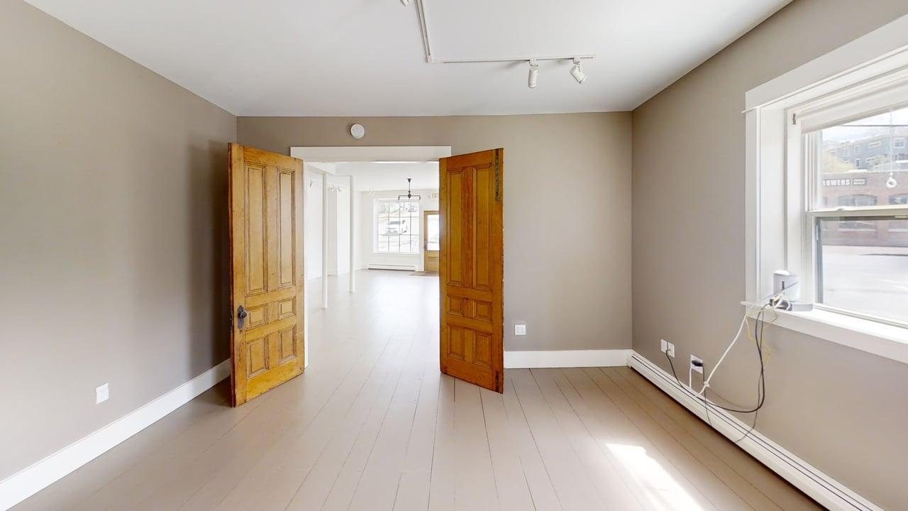 Back room with double doors opening to retail floor