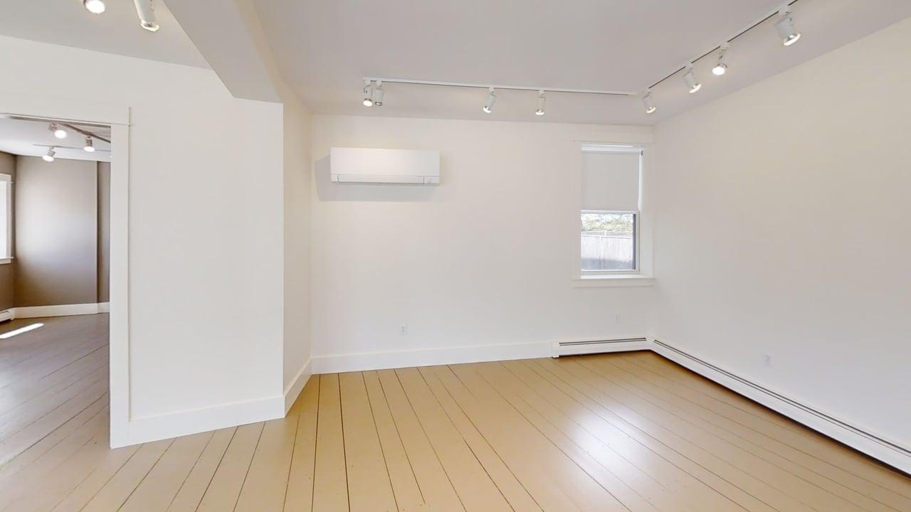 Second retail room with track lighting